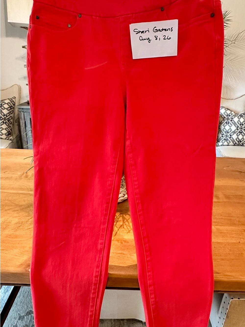 Tru Luxe pull on jean with stretch. Frayed hem and flat panel front. Red.